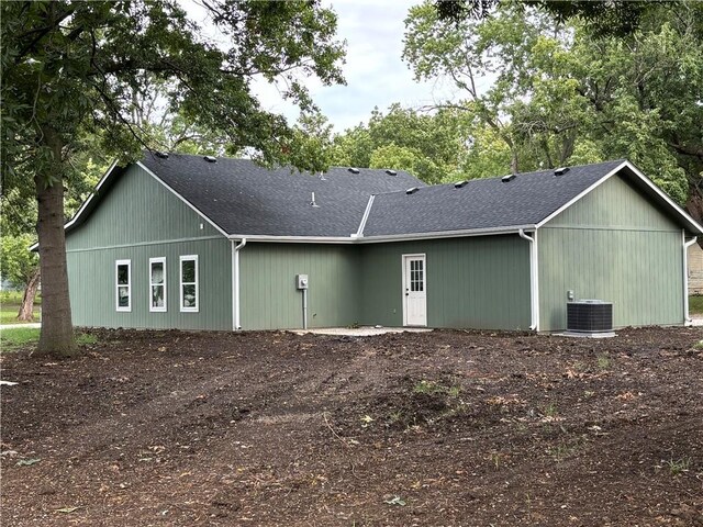 back of house featuring central air condition unit