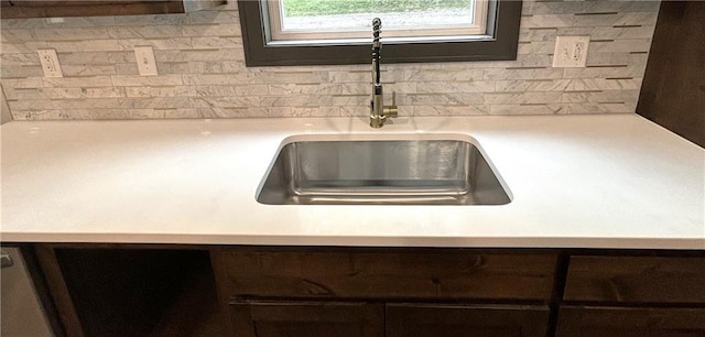 room details with sink and dark brown cabinetry