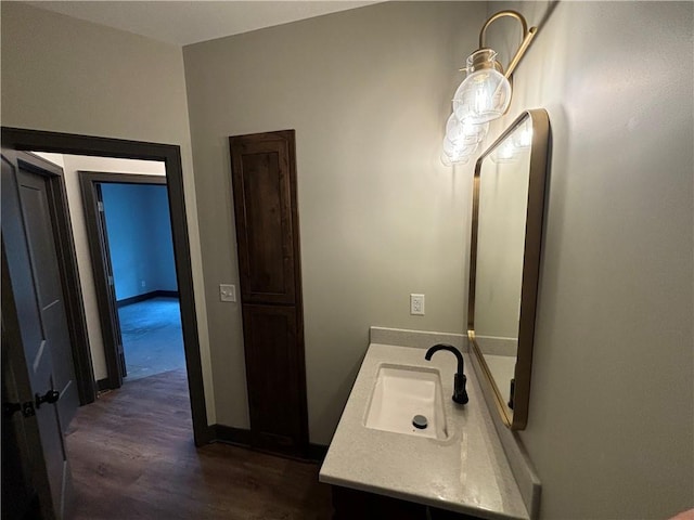 bathroom with wood-type flooring and vanity