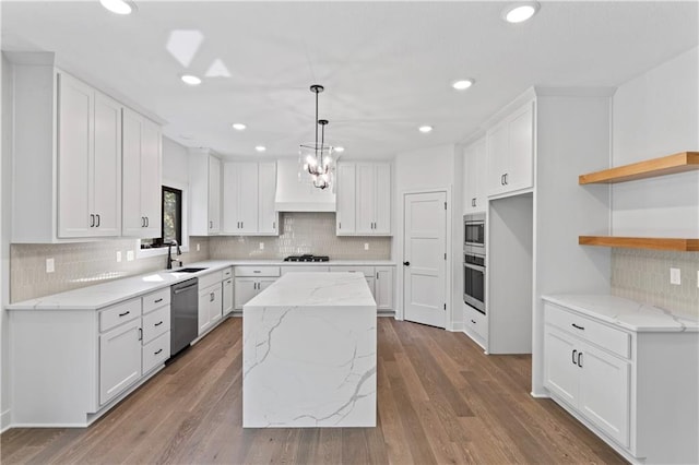 kitchen featuring a center island and white cabinets