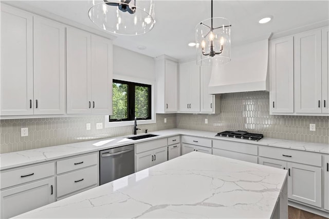 kitchen with backsplash, stainless steel appliances, white cabinets, and sink