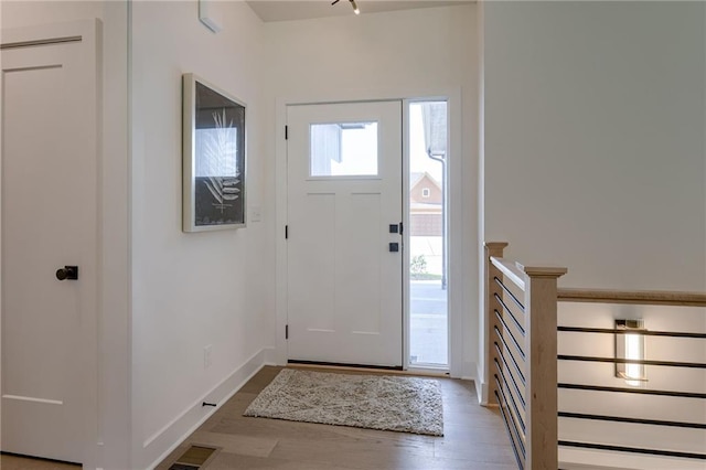 4805 NE 62nd St, Kansas City, MO 64119 - entryway with wood finished floors and baseboards