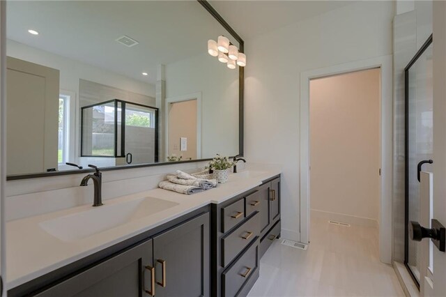 4805 NE 62nd St, Kansas City, MO 64119 - bathroom with double vanity, a stall shower, and recessed lighting