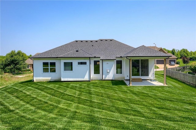 4805 NE 62nd St, Kansas City, MO 64119 - back of property with a patio and roof with shingles