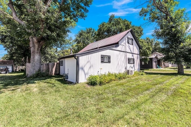 view of home's exterior with a yard