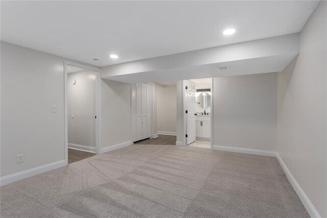 basement with carpet flooring