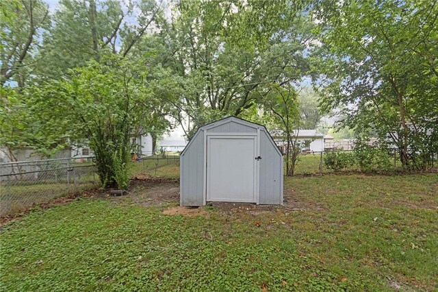 view of outbuilding with a yard