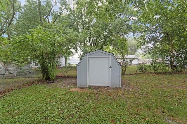 view of shed with a fenced backyard