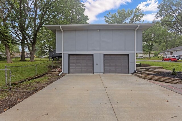 garage featuring a yard