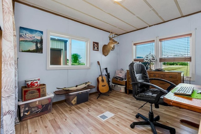 office area with light hardwood / wood-style floors