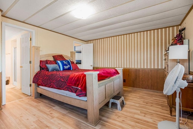 15124 NW County Road 14001st Rd, Drexel, MO 64742 - bedroom with wainscoting and wood finished floors