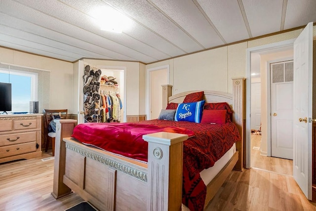 15124 NW County Road 14001st Rd, Drexel, MO 64742 - bedroom with a spacious closet, a closet, and light wood-style flooring