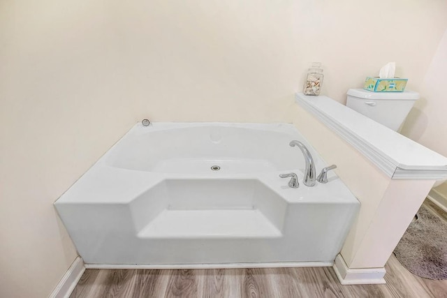 15124 NW County Road 14001st Rd, Drexel, MO 64742 - full bathroom featuring a garden tub, toilet, and wood finished floors