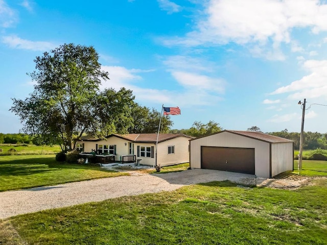 ranch-style house featuring a garage and a front yard