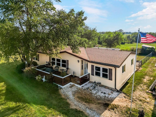 15124 NW County Road 14001st Rd, Drexel, MO 64742 - back of property with fence, roof with shingles, a yard, and a deck