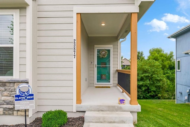 entrance to property with a yard