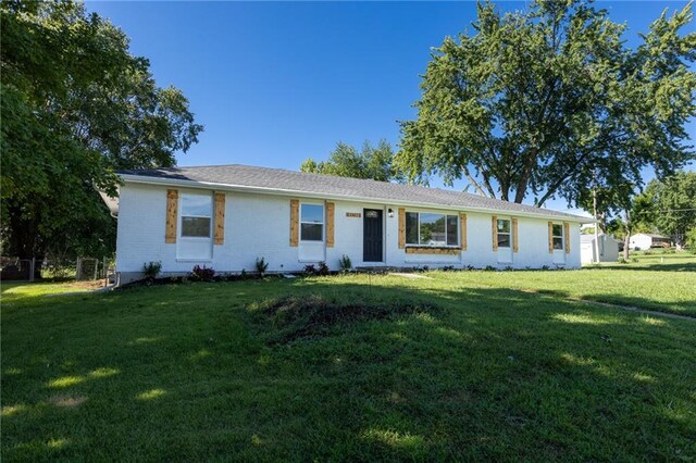 ranch-style house with a front yard