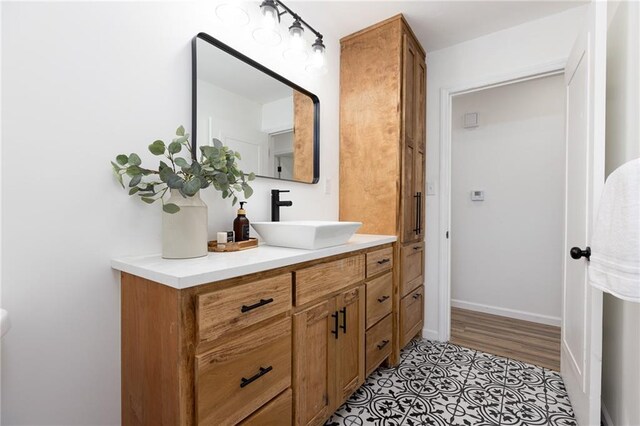 bathroom with wood-type flooring and vanity