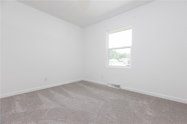 unfurnished room with carpet floors