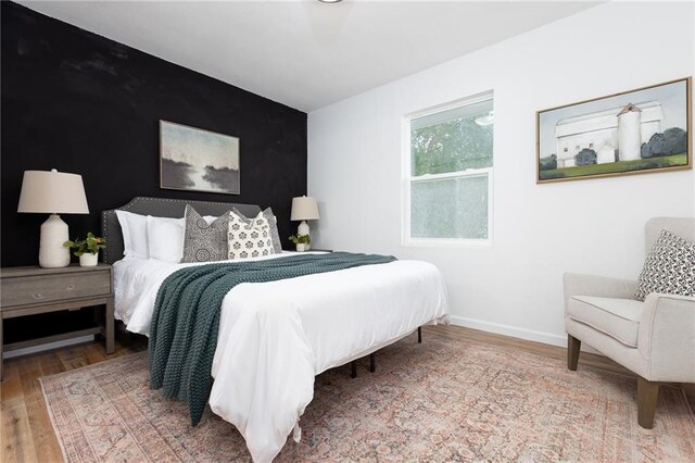 bedroom featuring hardwood / wood-style flooring