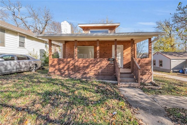 bungalow-style house with a front lawn