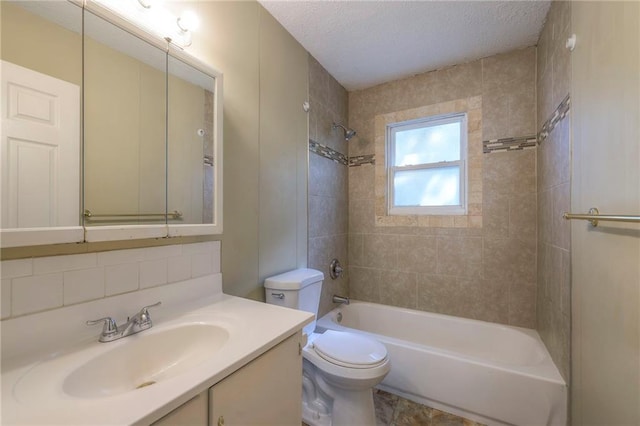 full bathroom featuring toilet, vanity, tasteful backsplash, a textured ceiling, and tiled shower / bath combo