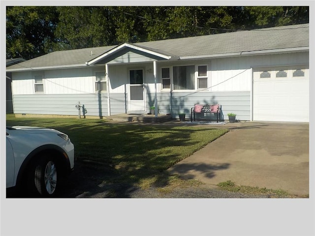 single story home with a garage and a front lawn