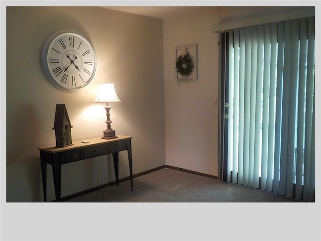 view of carpeted entrance foyer