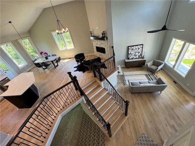 interior space featuring high vaulted ceiling, a healthy amount of sunlight, and wood-type flooring