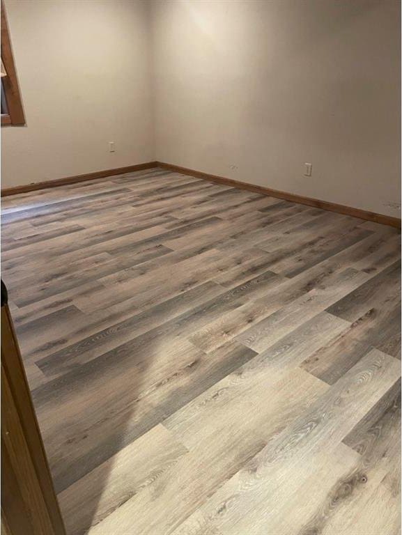 spare room featuring dark hardwood / wood-style flooring