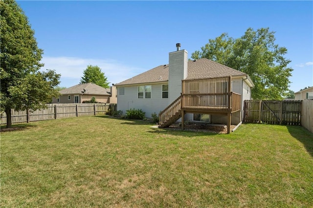 back of house featuring a wooden deck, stairway, a fenced backyard, and a lawn