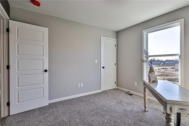 unfurnished office featuring carpet floors