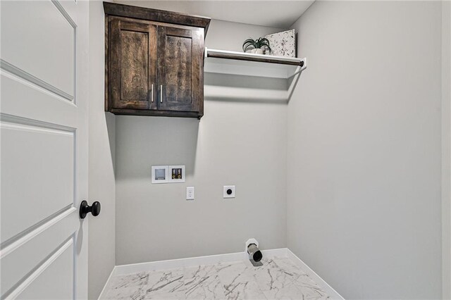 clothes washing area with electric dryer hookup, cabinets, and hookup for a washing machine