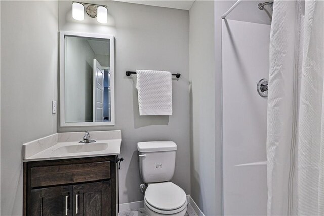 bathroom with toilet and vanity