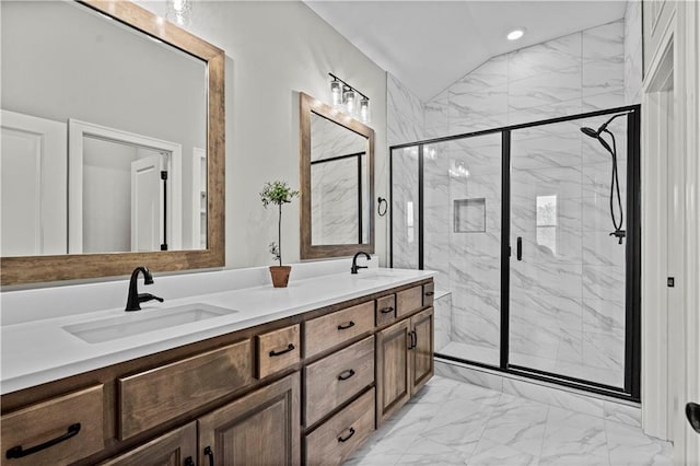 bathroom with vaulted ceiling, vanity, and an enclosed shower