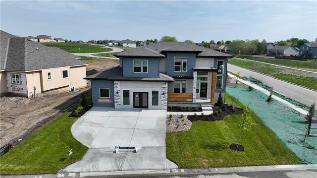 view of front of property with a front yard and french doors