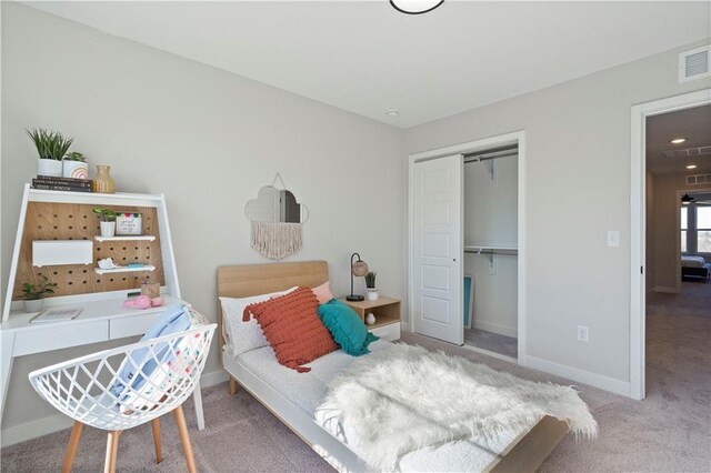 carpeted bedroom featuring a closet