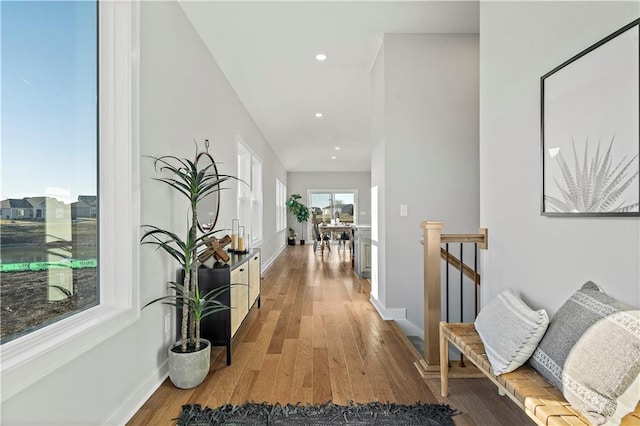 hall with light hardwood / wood-style floors