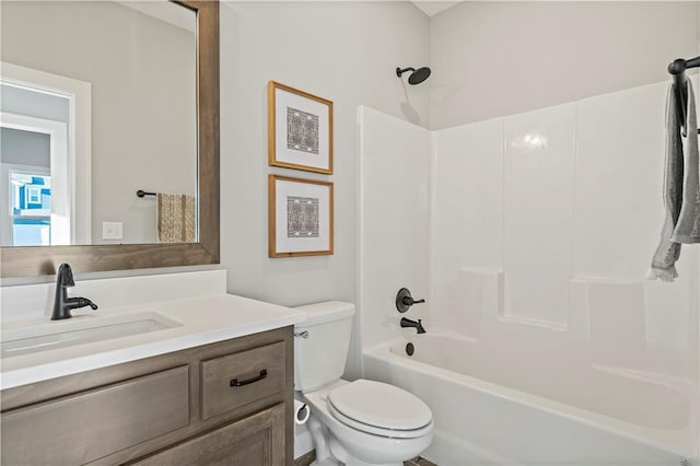 full bathroom with washtub / shower combination, vanity, and toilet