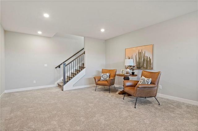 sitting room with light colored carpet