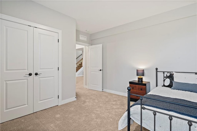 carpeted bedroom featuring a closet