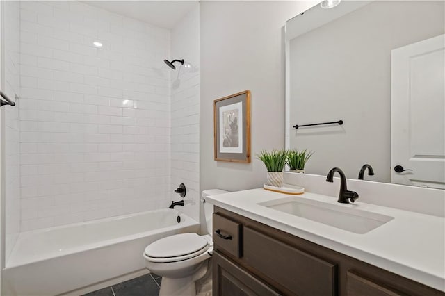 full bathroom featuring tiled shower / bath combo, vanity, tile patterned floors, and toilet