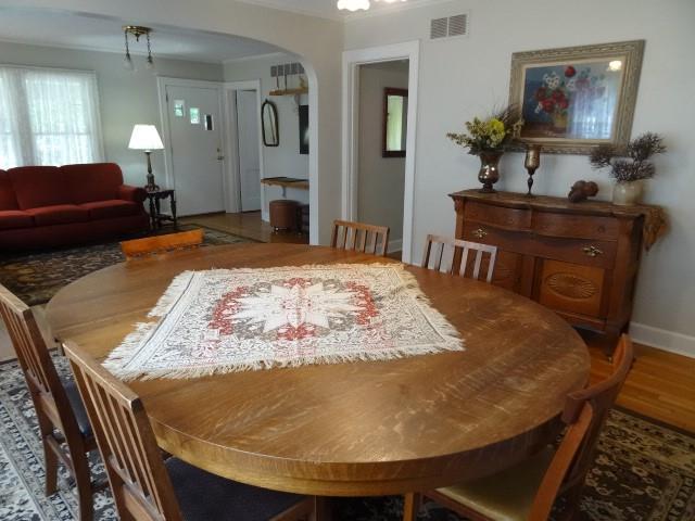 dining space with hardwood / wood-style floors