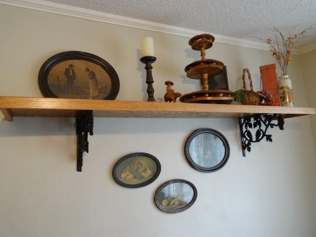 room details with ornamental molding and a textured ceiling