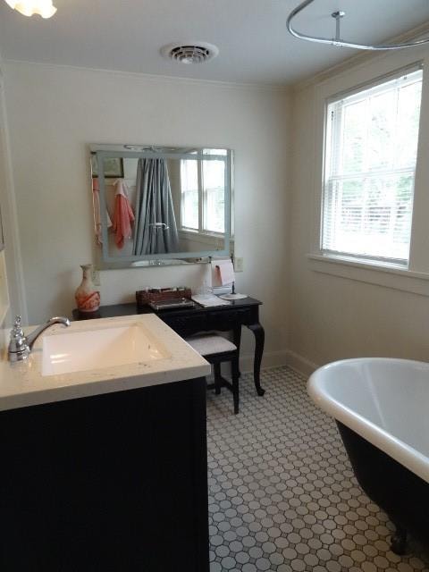 bathroom with vanity and tile patterned floors