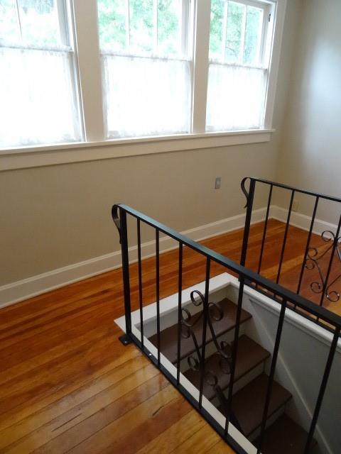 staircase featuring hardwood / wood-style floors