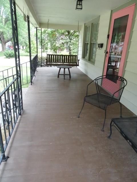 wooden deck featuring covered porch