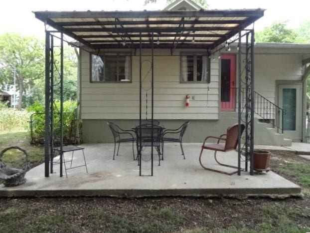 rear view of property with a patio area