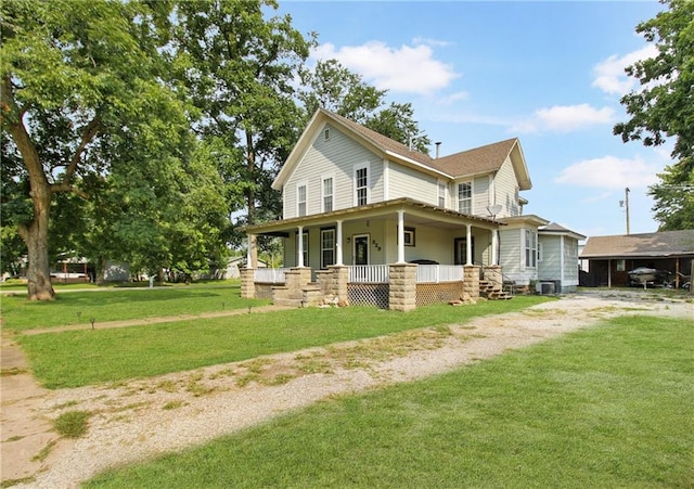 view of home's exterior featuring covered porch and a lawn