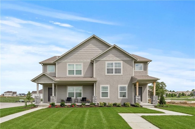 craftsman-style house featuring a front yard and a porch